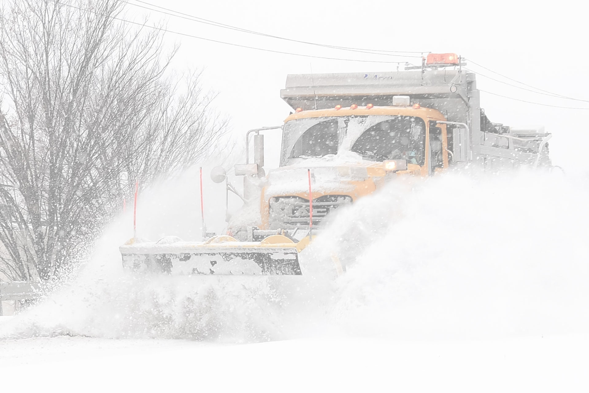 O'Bryan Grounds Maintenance truck plowing snow